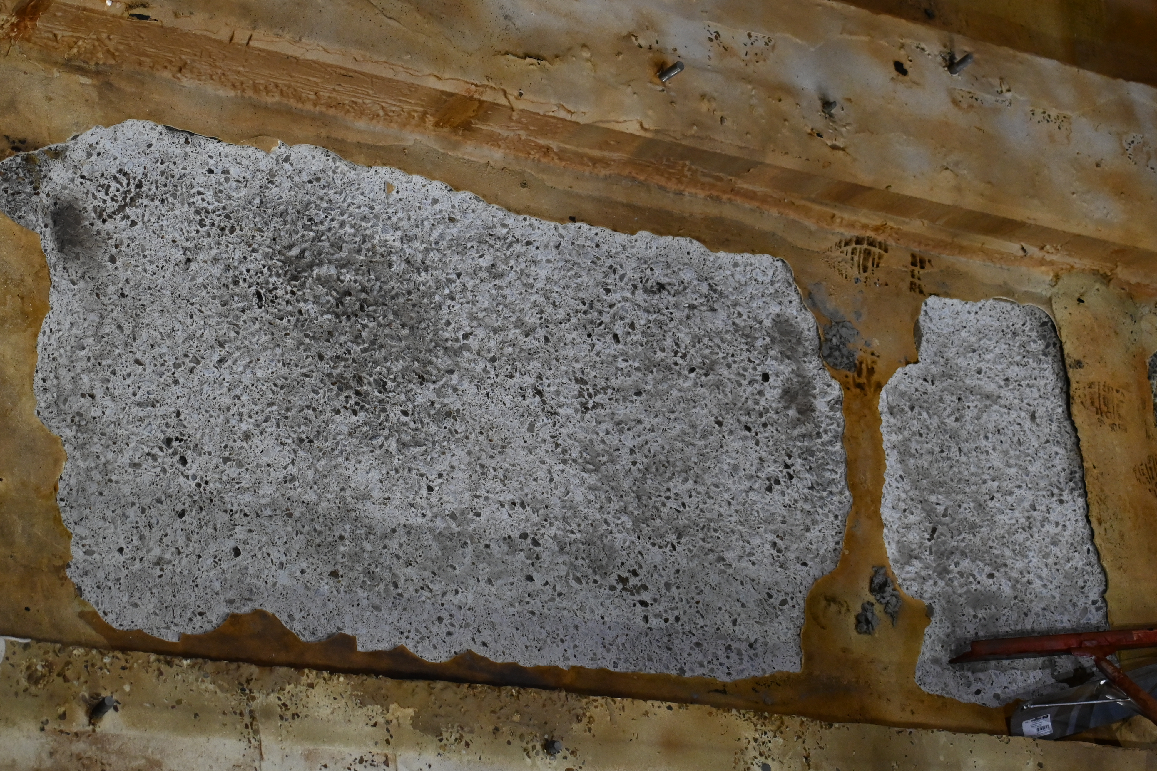 Car well surface cleaned and prepared for repair mortar application